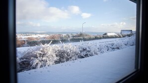 A snowy landscape with a clear sky and distant buildings. - Large Apartment With Fabulous View Of Tórshavn (Tórshavn)