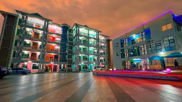 A multi-story building with balconies and a courtyard. - Mercy Royal Heights (Kumasi)