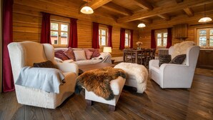 A cozy log cabin interior with a living room, dining area, and kitchen. - Vysoke nad Jizerou Kkh070 (Vysoké nad Jizerou)