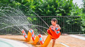 Seasonal outdoor pool, open 10:30 AM to 6:30 PM, pool umbrellas