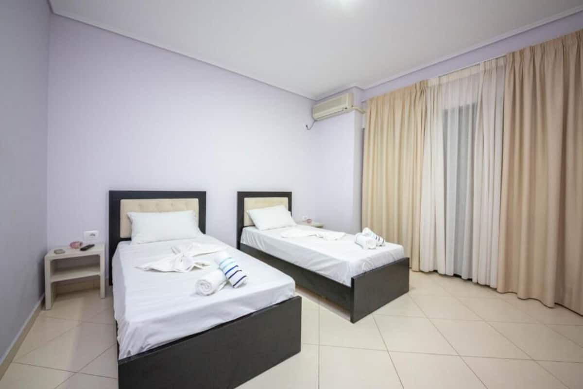 Studio, 2 Twin Beds, Balcony | 2 bedrooms, desk, blackout drapes, free WiFi
