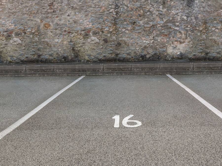 A parking space marked with the number 16.