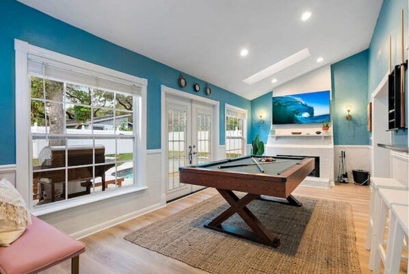 Relax in a stylish space with a pool table, flat-screen TV, and outdoor views.