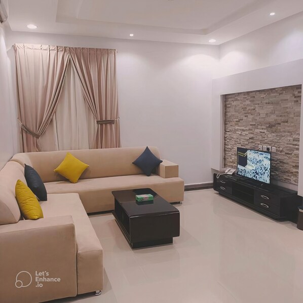 Apartment, 1 Bedroom | Living area | 45-inch LED TV with cable channels, printers - Evan Suites Serviced Apartments (Riyadh)
