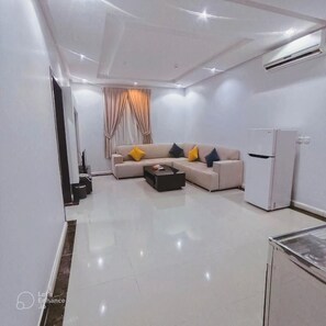 Apartment, 1 Bedroom | Living area | 45-inch LED TV with cable channels, printers - Evan Suites Serviced Apartments (Riyadh)