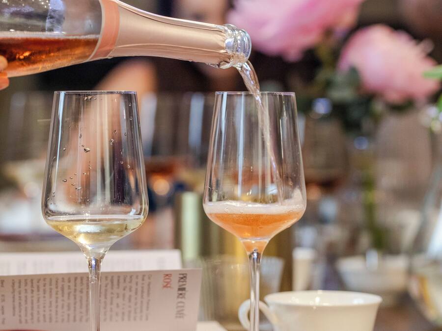 A bottle being poured into a glass.