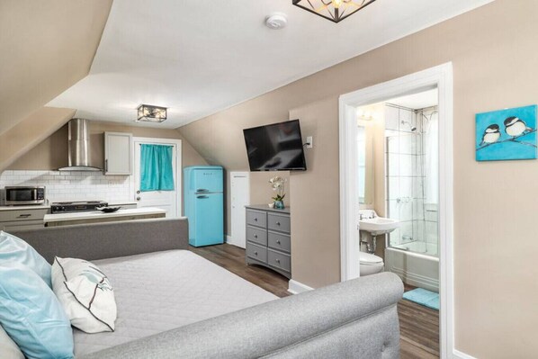 1 bedroom, desk, iron/ironing board, travel crib