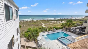 A pool area with a view of the beach and ocean. - Amazing view from this 3rd story oceanfront condo w/private balcony and pool (North Myrtle Beach)
