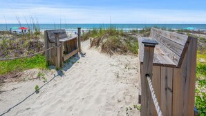 A wooden beach entrance with a sandy path leading to the ocean. - Amazing view from this 3rd story oceanfront condo w/private balcony and pool (North Myrtle Beach)