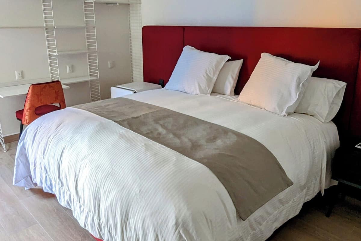 Deluxe Room | 1 bedroom, desk, laptop workspace, iron/ironing board