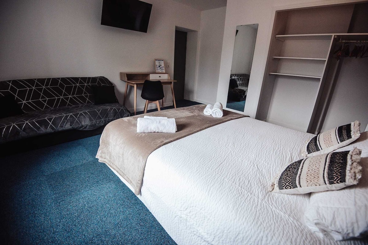 Family Room | Premium bedding, memory-foam beds, desk, laptop workspace