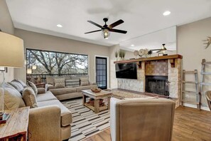 Condo, Multiple Beds, Pool Access (371 W Lincoln C216) | Living area | Fireplace - Luxury Riverfront Condo 1 BLK to Schlitterbahn! (New Braunfels)
