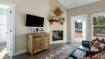 Cottage, 1 King Bed, Patio, Mountain View | Living area | TV, fireplace
