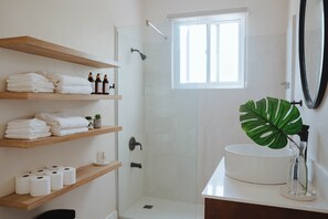 Shower, hair dryer, towels, soap