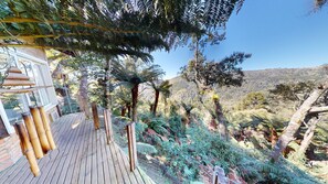 Cabana design, banheira de hidromassagem | Terraço/pátio