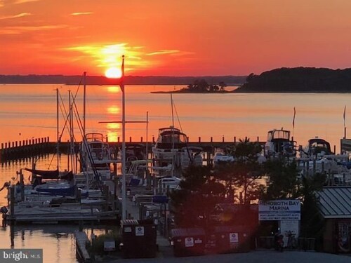 Town of Dewey Beach condo with marina views, pool, balcony