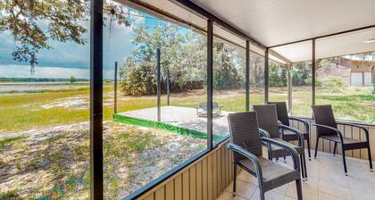 Waterfront stay with a dock, firepit, grill, sunroom, separate studio, W/D, & AC