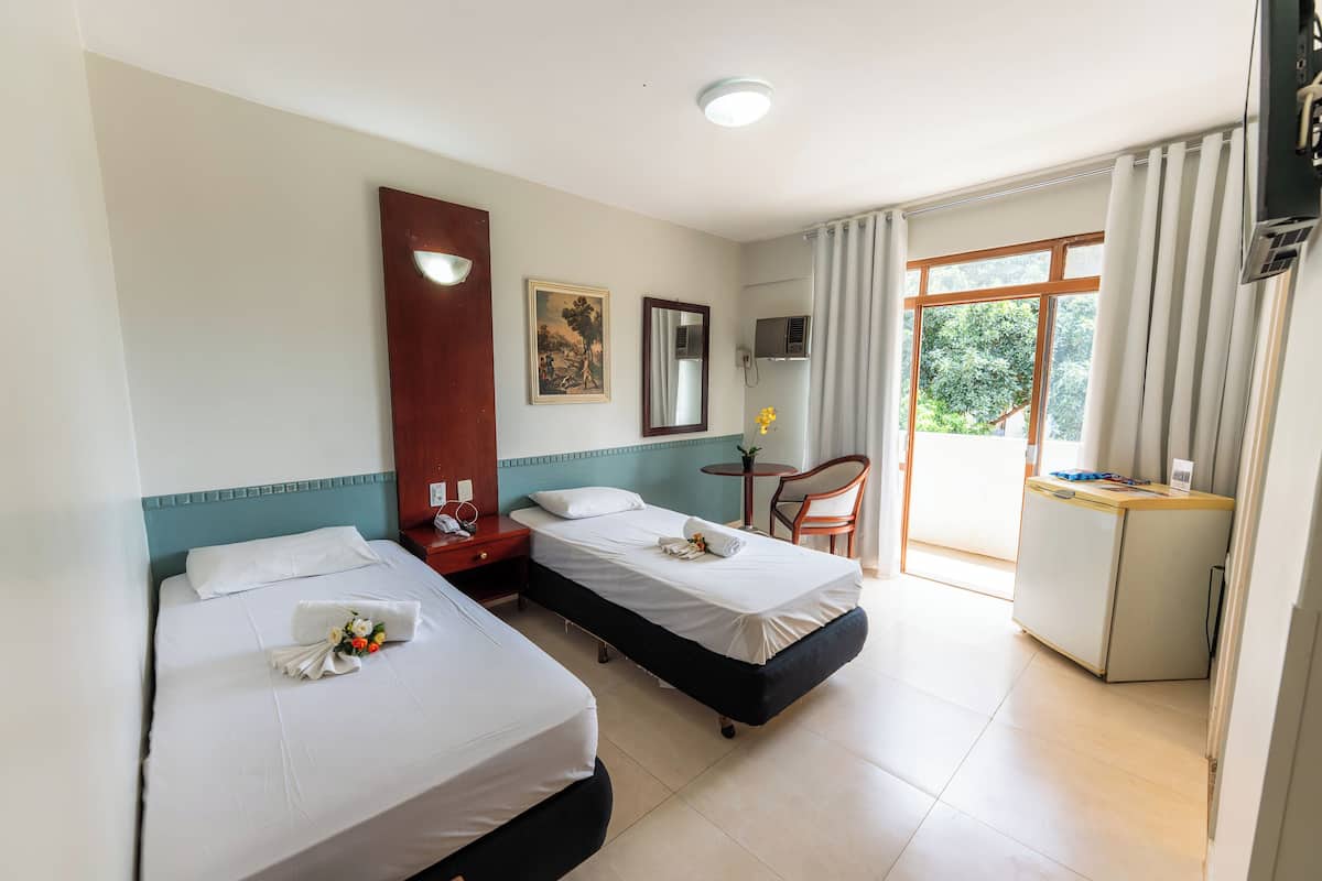 Deluxe Twin Room | Minibar, desk, laptop workspace, blackout drapes