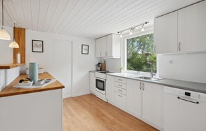 Fridge, stovetop, dishwasher, coffee/tea maker