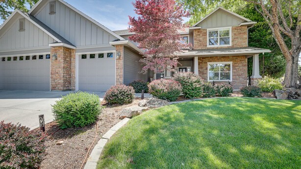 A two-story house with a garage, a brick exterior, and a well-maintained lawn. - Pet-Friendly Meridian Vacation Rental w/ Fire Pit! (Meridian)