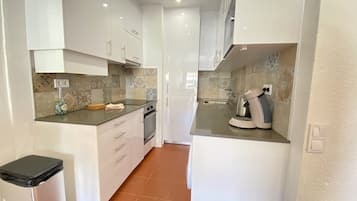 Apartment, 1 Bedroom, Pool Access | Private kitchen | Microwave, oven, dishwasher, coffee/tea maker