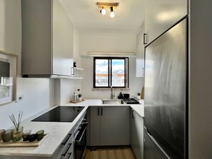 Apartment, 1 Bedroom, Terrace | Private kitchen - Albufeira Design by Homing (Albufeira)