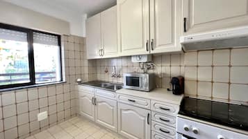 Apartment, 2 Bedrooms, Pool Access | Private kitchen | Microwave, oven, coffee/tea maker, electric kettle