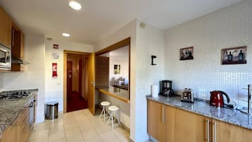 Apartment, 1 Bedroom, Pool Access | Private kitchen | Microwave, oven, dishwasher, coffee/tea maker