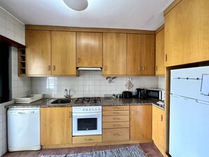 Microwave, dishwasher, coffee/tea maker, cookware/dishes/utensils