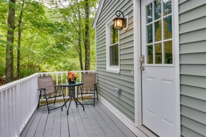Step out onto the deck and enjoy the serene surroundings from the comfort of your outdoor space.