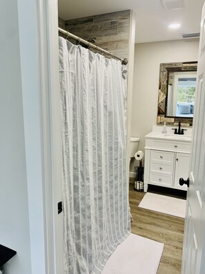 Shower, towels, soap, toilet paper