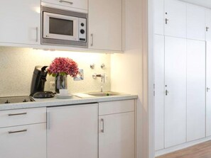 Fridge, microwave, stovetop, coffee/tea maker