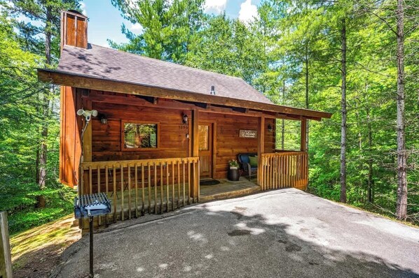 A wooden cabin with a porch, a chimney, and a mailbox. - Location! Private Log Cabin, Hot Tub, Fireplace (Pigeon Forge)