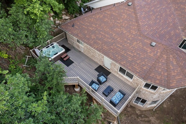 An aerial view of a house with a deck, a hot tub, and outdoor seating. - Spacious Mountain Hideaway 4 BD 3 BA W/ Hot Tub (Ogden)