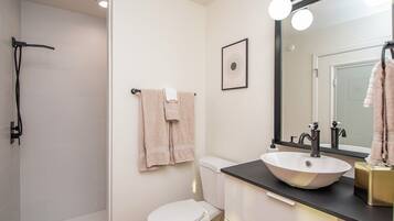 Shower, hair dryer, towels, soap