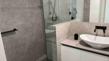 Shower, hair dryer, towels, soap