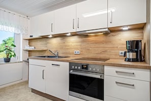 Coffee/tea maker, fridge, microwave, oven