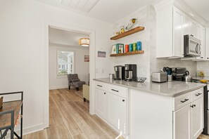 Fridge, microwave, oven, stovetop - Sunflower Hideaway -Walk to eats, bike to beach, pet friendly, Relaxed backyard. (St. Simons Island)
