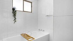 Bathtub, hair dryer, towels