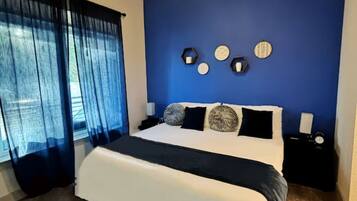 1 bedroom, desk, iron/ironing board, travel crib