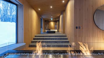 Tsubasa at Hanaridge 4+1 Bedroom Chalet with Onsen | Living area | 30-inch flat-screen TV with digital channels, fireplace, Netflix