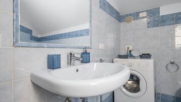 Bathtub, hair dryer, towels