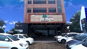 A hotel building with a prominent sign for "AAD MYRA GRAND SUITE". - AAR Royal Residency - Palmyra (Palayankottai)