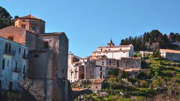 A historic town with a prominent church tower and traditional buildings.