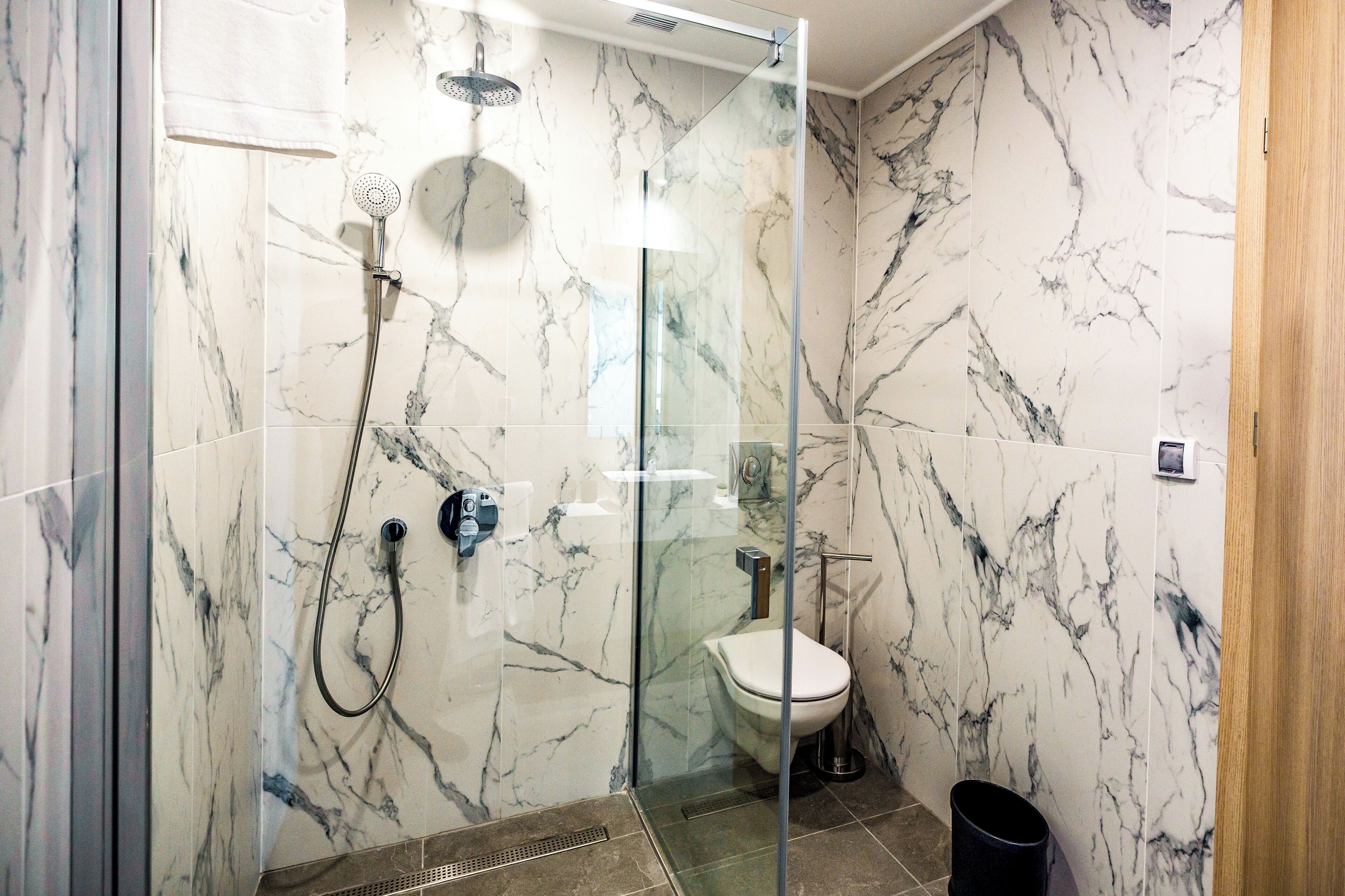 junior suite, 1 king bed | bathroom | shower, rainfall showerhead, hair dryer, slippers