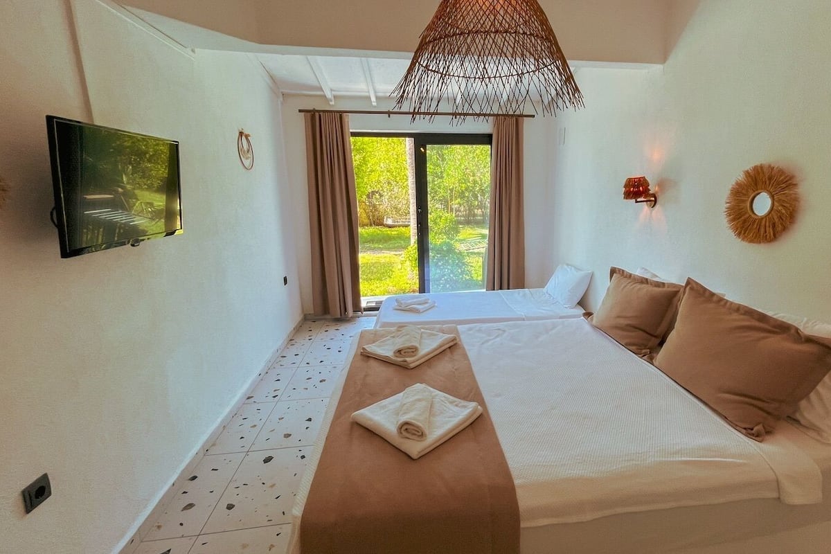 Standard Triple Room, Garden View | Premium bedding, minibar, free WiFi, bed sheets