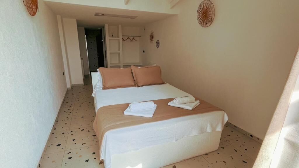 Habitación cuádruple Deluxe, vista al mar | Ropa de cama de alta calidad, minibar, wifi gratis y ropa de cama 