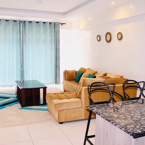 Executive Apartment | Living area | 42-inch flat-screen TV with digital channels, TV - Stay.Plus Silverstone Apartments (Nairobi)