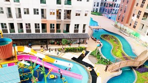 A multi-level water park with slides, pools, and a bridge. - Transpark Juanda Bekasi by 21 Room (Bekasi)