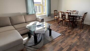 Apartment, Multiple Beds | Living area | Flat-screen TV, fireplace